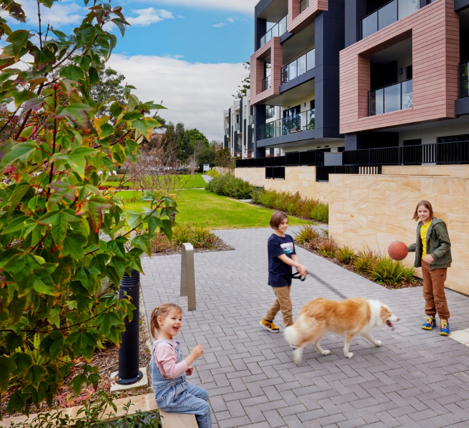Greater Adelaide Regional Plan - Three children playing outside of residential buildings